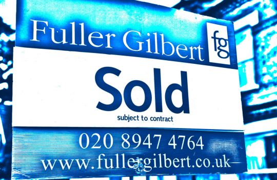 Image of A Fuller Gilbert Estate Agency 'Sold' Property Board Outside of a house