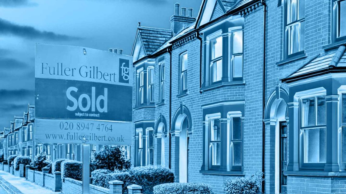 Image of a Fuller Gilbert Estate Agents 'Sold' board outside terraced houses